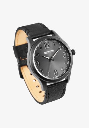 Black analog wristwatch with a matte finish, large numerals on a dark dial, silver accents, leather strap, and circular case design.
