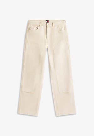 Beżowe spodnie o prostych nogawkach z dużymi przednimi kieszeniami na udach, szlufkami na pasek, metalowym zapięciem na guzik oraz małym logo Tommy Hilfiger na prawej kieszeni.