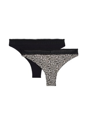 Deux strings pour femmes avec ceintures en dentelle ; un noir uni, un blanc avec imprimé léopard noir et marron.