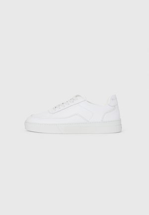 White low-top sneaker with lace-up front, smooth upper, and rubber sole on plain light background.