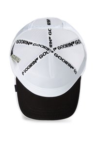 White mesh trucker cap with a black front panel, featuring a branded black tape inside and a curved brim. Interior stitching is visible.
