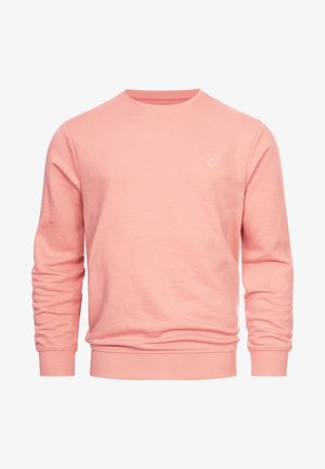 Rosa Sweatshirt mit Rundhalsausschnitt und gerippten Bündchen. Verfügt über ein kleines, kreisförmiges, weißes Logo auf der Brust. Aus weichem Baumwollmix gefertigt.
