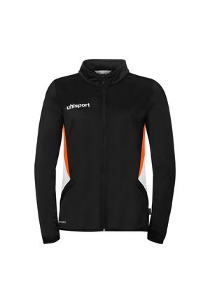 Veste de sport noire à fermeture éclair avec des panneaux latéraux orange et blanc, manches longues, et logo "uhlsport" sur le côté supérieur gauche de la poitrine.