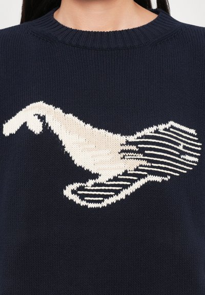 Navy knitted sweater featuring an off-white graphic design of a hand with linear accents. Ribbed neckline and smooth texture.