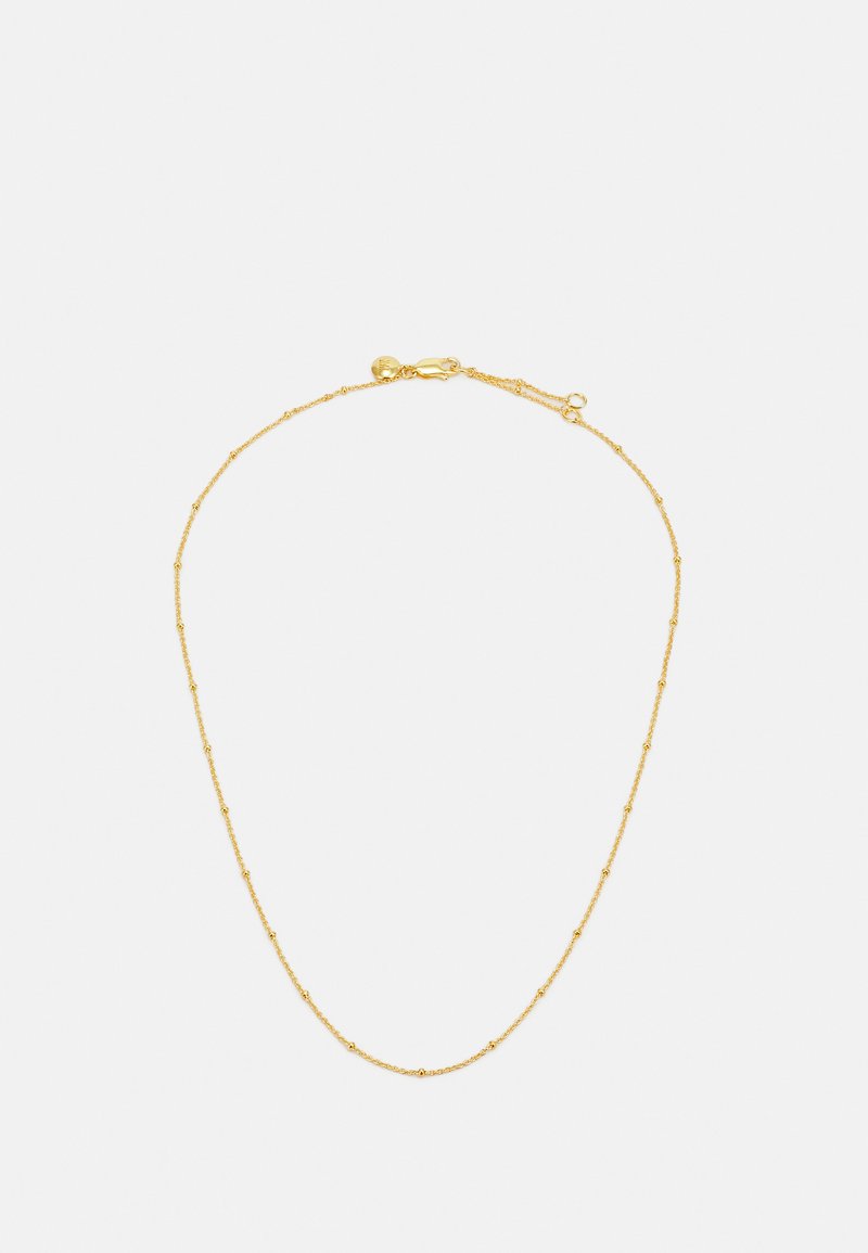 Kuldne kaelakee, millel on keeruline disain, mille ääres on väiksed, üksteisest eemal paiknevad helmed. Sulgemiseks turvaline konks.