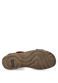 Braune Gummisohle mit welligem Profil. Enthält das Markenetikett "JOSEF SEIBEL". Verfügt über ein flaches Profil und eine strukturierte Oberfläche für besseren Halt.