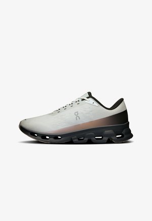 Running shoe with a lightweight mesh upper in gray, accented by a gradient from light to dark. Black sole with cutouts for cushioning.