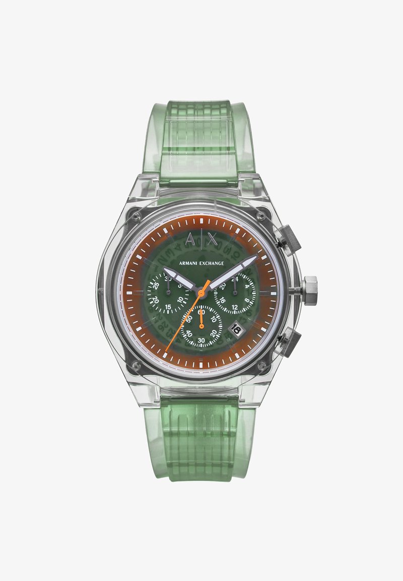 Διαυγής, οκταγωνικός ρολόι με διαφανή κάσα, πράσινο σιλικονένιο λουράκι, καφέ-πορτοκαλί καντράν, λευκές ενδείξεις και τρεις υποκαντράν.