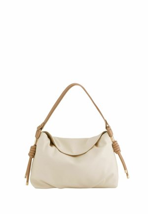 Beżowa miękka skórzana torba na ramię z pojedynczym paskiem zakończonym supełkami oraz detalami z metalu w kolorze złotym.