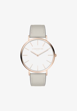 Runde Uhr mit weißem Zifferblatt, roségoldenen Stundenmarkierungen und einem hellgrauen Lederarmband. Einfaches Design mit minimalistischen Merkmalen.