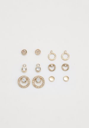 Set of earrings featuring gold-tone metal, various designs including studs and hoops, with clear crystals and round accents.