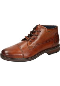 Braune Leder-Stiefelette mit runder Zehenform, kontrastierenden Nähten und strukturierten Akzenten an der Ferse. Schnürdesign mit gepolstertem Kragen.