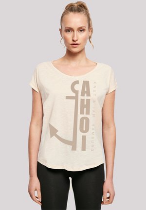 Light beige short-sleeve t-shirt with a rounded neckline, featuring a large graphic print of the word "AHOI" and an anchor design.