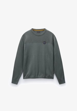 Green sweatshirt with a textured upper section, ribbed cuffs and hem, round neck, and a circular logo detail on the chest.