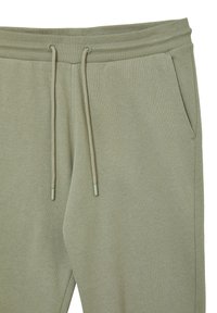 Schmal geschnittene Jogginghosen aus weichem, hellgrünem Baumwollgemisch. Mit elastischem Bund, verstellbaren Kordeln und seitlichen Taschen.