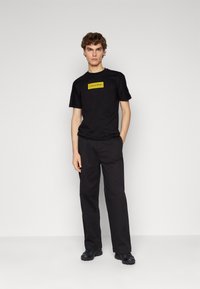 Calvin Klein MODERN RELAXED WIDE - Broek - black