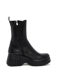 Bottine noire en cuir lisse, dotée d'une fermeture éclair sur le côté et d'une semelle crantée épaisse pour plus de hauteur et d'adhérence.