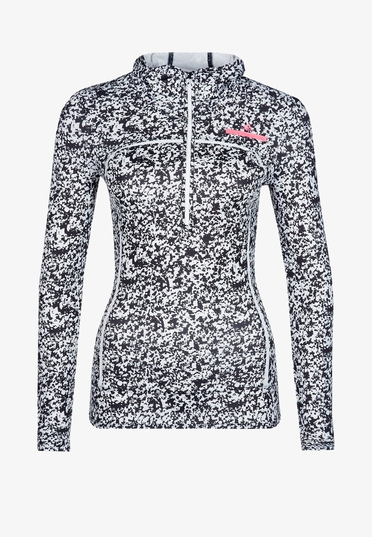 Långärmad idrottströja i svart och vitt kamouflagemönster, med halvdragkedja och rosa logotyp på bröstet. Tillverkad av stretchigt material.