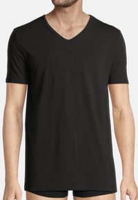 Black short-sleeve t-shirt with a v-neckline, made from a smooth fabric, featuring a relaxed fit and minimal stitching details.