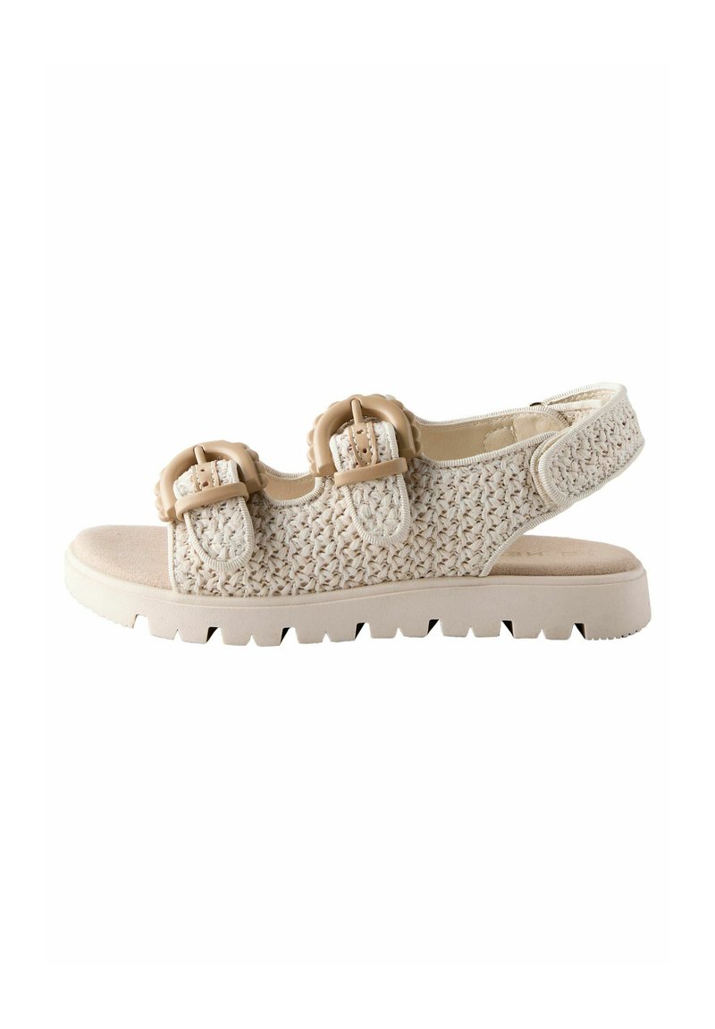 Beige gewebte Sandalen mit doppelten verstellbaren Schnallen, gepolstertem Fußbett und einer strukturierten, robusten Sohle. Offene Zehen- und Fersenpartie für Atmungsaktivität.
