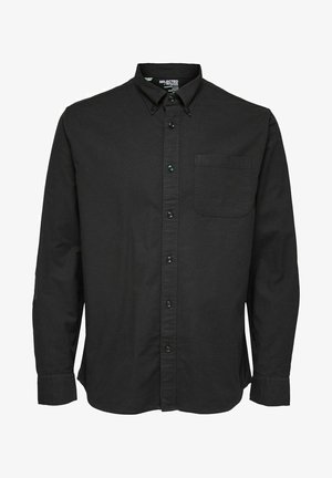 Camisa preta de manga longa, com botões, feita em tecido de algodão, apresentando um colarinho padrão, bolso frontal e botões pretos combinando.