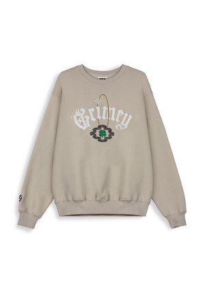 Beige sweatshirt met brede mouwen, geribbelde manchetten en onderrand. Beschikt over "Grimey" letters en een klaverontwerp in groen en blauwe borduring.