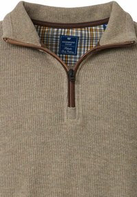 Beżowy sweter z prążkowanej tkaniny z ćwierć zamkiem błyskawicznym, z brązowym zamkiem i wewnętrzną podszewką w kratkę w kolorze żółtym i niebieskim. Widoczna metka.