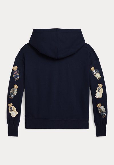 Námořnická bavlněná mikina s kapucí na šňůrku, která má na rukávech vyšívané medvídky v různých oblečeních. Hranaté manžety a lem.