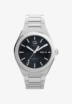 Silver stainless steel watch with a rounded case, black textured dial, white hour markers, and a date display showing "WED 14."