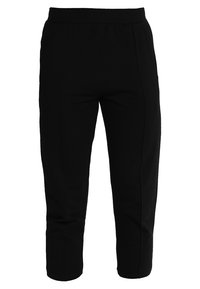 Svarta capri-längd byxor med elastiskt midjeband. Har en slät yta och sidofodringsdetaljer. Inga synliga fickor.