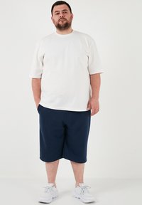 Buratti PLUS SIZE - Verryttelyhousut - indigo
