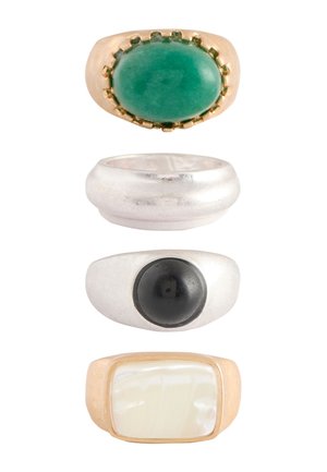 Four rings stacked vertically: gold with large green oval stone, plain silver band, silver with black round stone, gold with rectangular pearly stone.