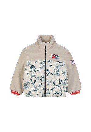 Veste pour enfants beige et crème avec manches en polaire, impression Mickey Mouse style bande dessinée, poignets rayés rouges et écussons sur le thème du ski à l'avant et sur la manche.