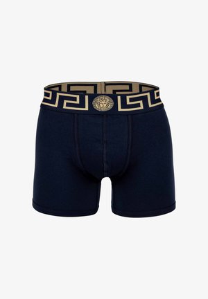 Navy boxer briefs with a gold geometric waistband featuring a Medusa emblem. Crafted from soft fabric with a snug fit and flat seams.