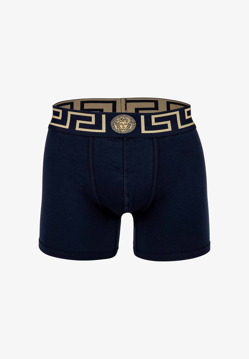 Navy boxer briefs with a gold geometric waistband featuring a Medusa emblem. Crafted from soft fabric with a snug fit and flat seams.