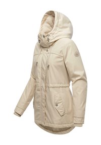 Beige parka met een met bont gevoerde capuchon, ritssluiting en drukknoopsluiting aan de voorkant, twee voorzakken en geribde manchetten. Glad buitenmateriaal.