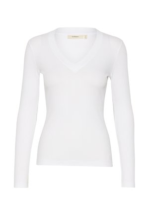 Top blanco de manga larga con textura acanalada y diseño de escote en V. Presenta una forma ajustada y detalles de costura sutiles en el escote y el dobladillo.