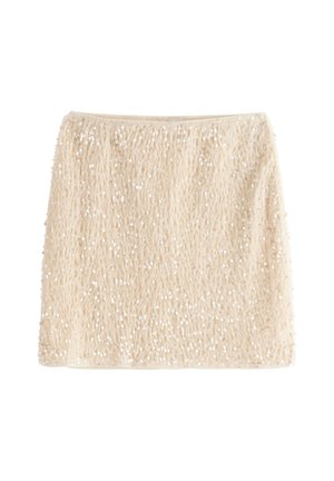 Beige skirt with a textured, fuzzy surface, adorned with scattered sequins for added shimmer. Straight shape with an elastic waistband.