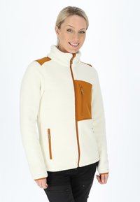 White fleece jacket with brown accents, high collar, and two zippered pockets. Features a front chest pocket with zip closure.