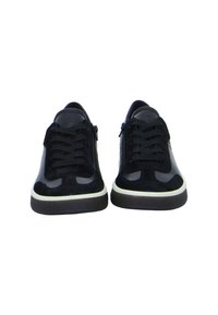 Black sneakers with a mix of suede and mesh materials. Features include laces, side zippers, and a contrasting white midsole.