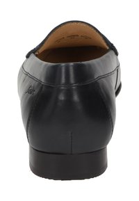 Schwarze Lederloafers mit runder Zehenpartie und glatter Oberfläche. Verfügt über einen niedrigen Absatz und dezente tonale Nähte entlang der Kanten.
