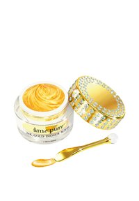 24K Gold Digger Peeling in einem klaren Glas mit einem goldenen Deckel, der mit Strasssteinen verziert ist. Enthält einen goldenen Applikator mit einer gerundeten Spitze.