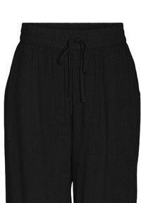 Svarta, texturerade byxor med resårmidja och dragsko. Tyget har ett subtilt rynkmönster som ger en avslappnad passform.