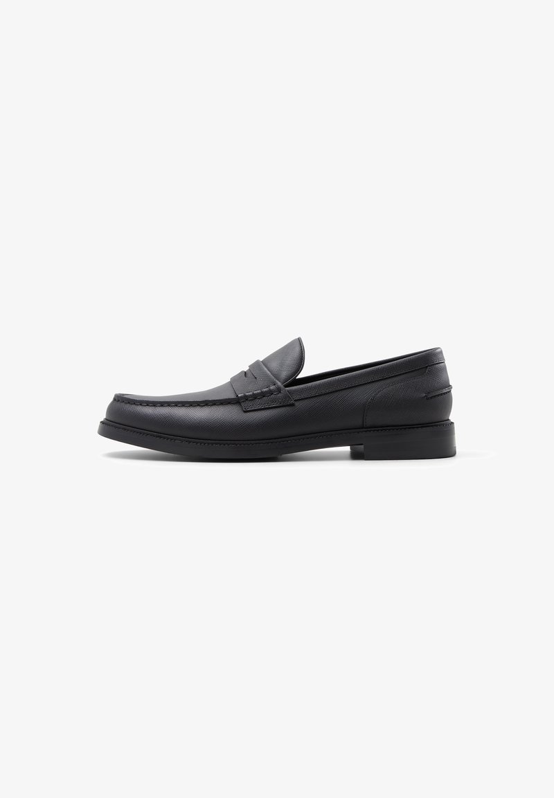 Sorte læder loafers med en glat tekstur, rund tå, syede detaljer og en lav blokhælk. Minimalistisk design uden udsmykninger.