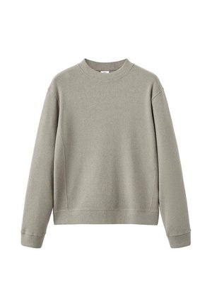 Beige neule, jossa on pitkät hihat ja pyöreä kaula-aukko, ribbireunuksilla hihoissa ja helmassa, esille nostettuna valkoista taustaa vasten.