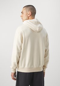 New Era MLB NEW YORK YANKEES FOOD GRAPHIC OVERSIZE HOODIE - Squadra - beige/navy