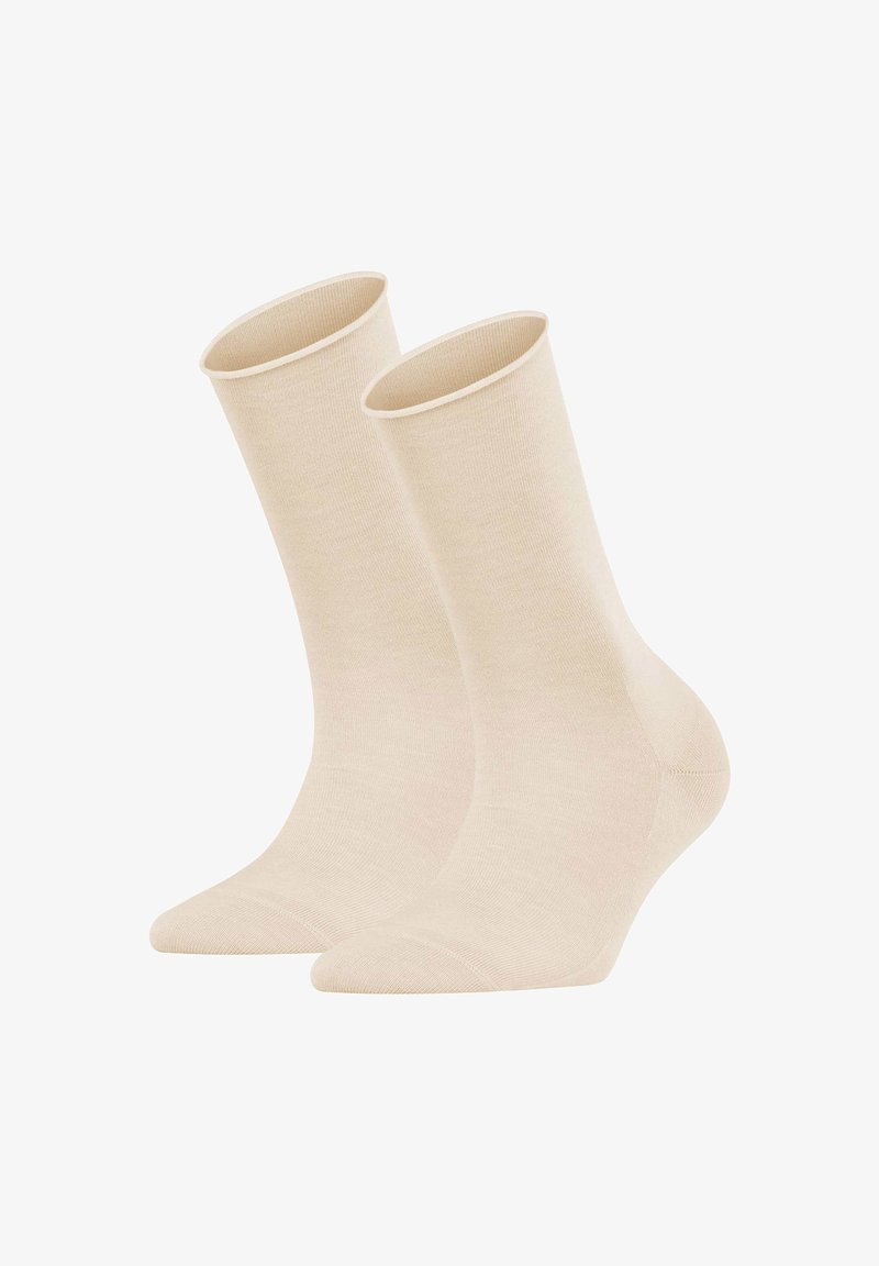 Beige Knöchelsocken aus einem glatten, dehnbaren Stoff. Sie verfügen über einen gerippten Saum und ein rundes Zehen-Design. Keine sichtbaren Muster oder Akzente.