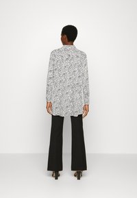 Lindex JANE - Blusa com botões - light white