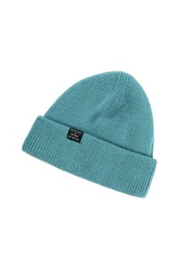 Teal gebreide beanie met een omgeslagen rand, voorzien van een rechthoekig zwart label met de tekst "PROTEST HOUSE OF SNOW" in witte letters.