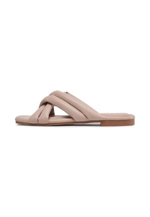 Beige flat slide sandal with padded, crossed straps and a low rectangular heel.